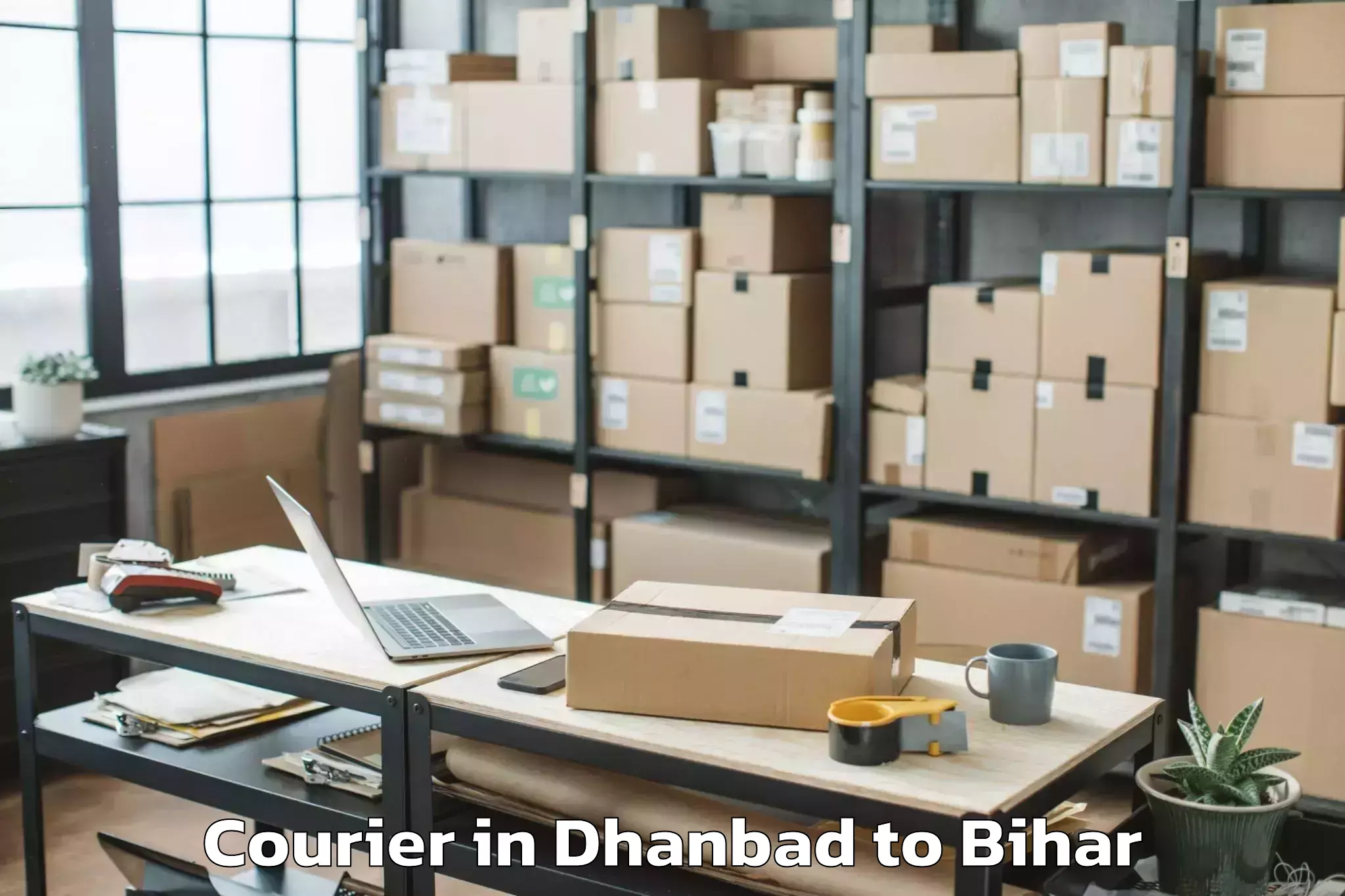 Easy Dhanbad to Wazirganj Courier Booking